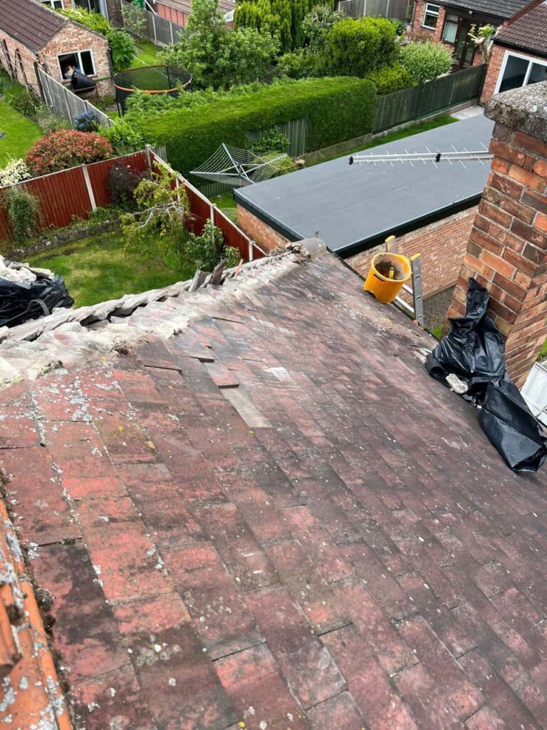 This is a photo of a roof where the hip tiles have been removed, and are just about to be replaced. Works carried out by Radcliffe on Trent Roofing Repairs